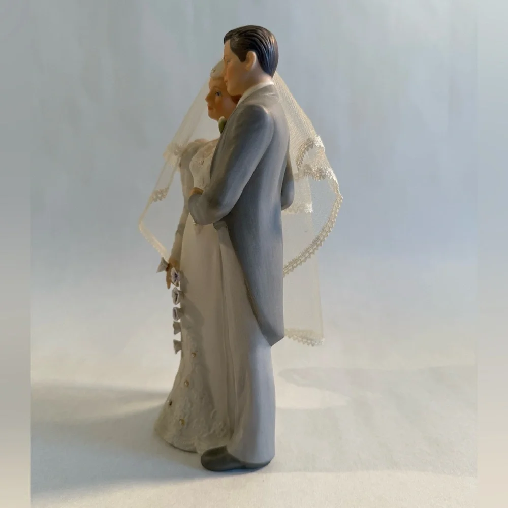 Elegant Wedding Cake Topper with Veil and Floral Accents